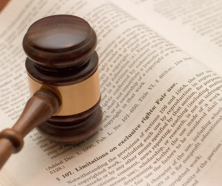 A book page with words about fair use with a gavel